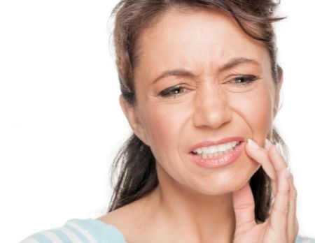 Woman portraying root canal tooth pain